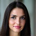 Headshot of Elena Popov, a woman with a confident expression, a client from an international trade company.